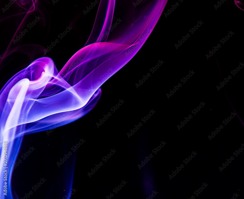 Colored smoke on black background