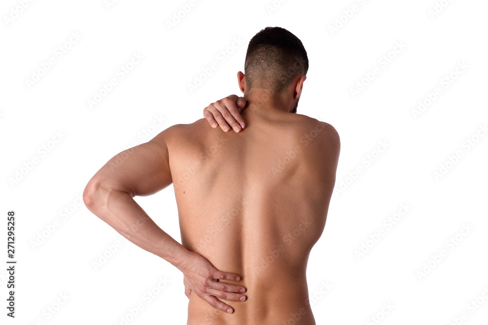 Young man with back pain. The athlete clings to a sore back. Man hurt his back. Sports medicine concept Young man with back pain. The athlete clings to a sore back. Man hurt his back. Sports medicine concept