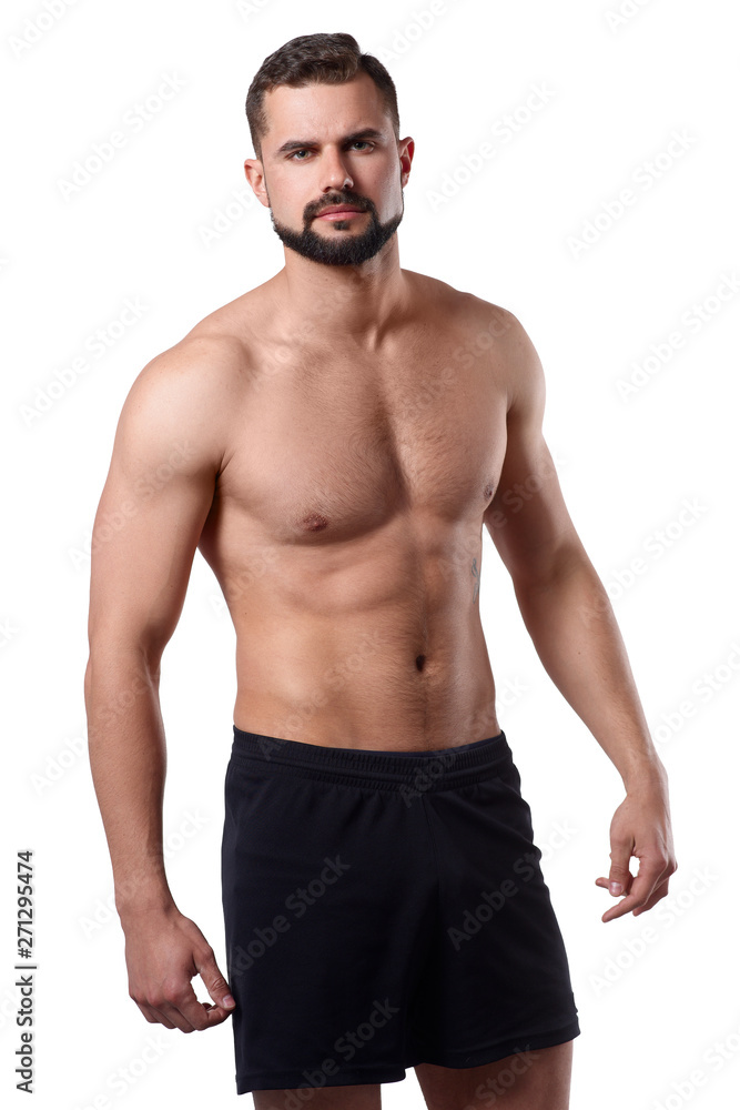 Handsome muscular man on isolated background shows his body. Sportsmans body. Sport concept