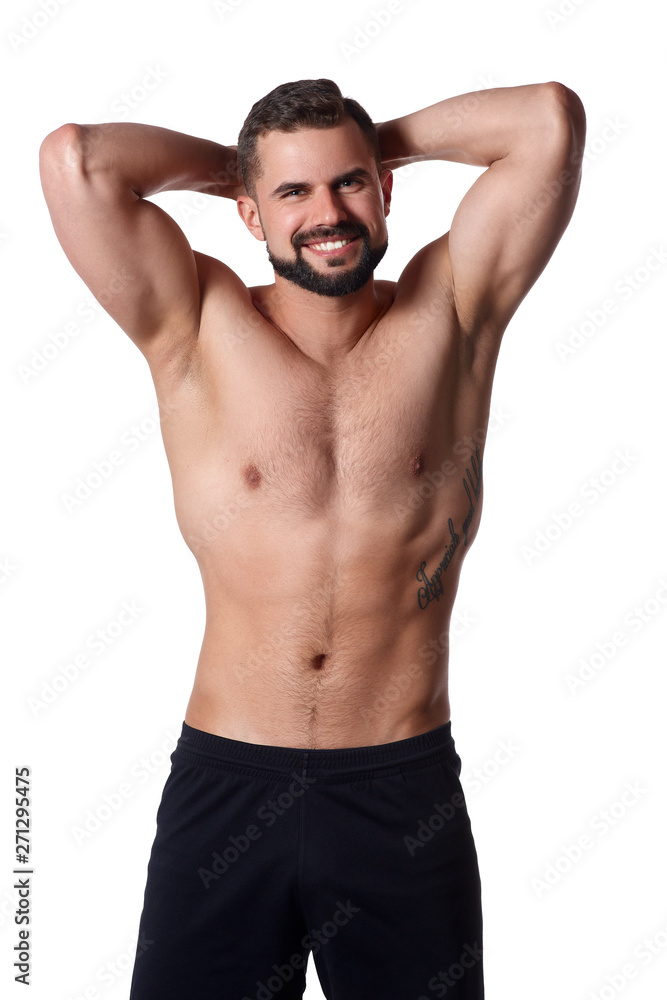 Handsome muscular man on isolated background shows his body. Sportsmans body. Sport concept Handsome muscular man on isolated background shows his body. Sportsmans body. Sport concept