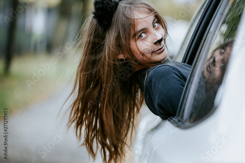 Girl in a cat's costume at Halloween photo