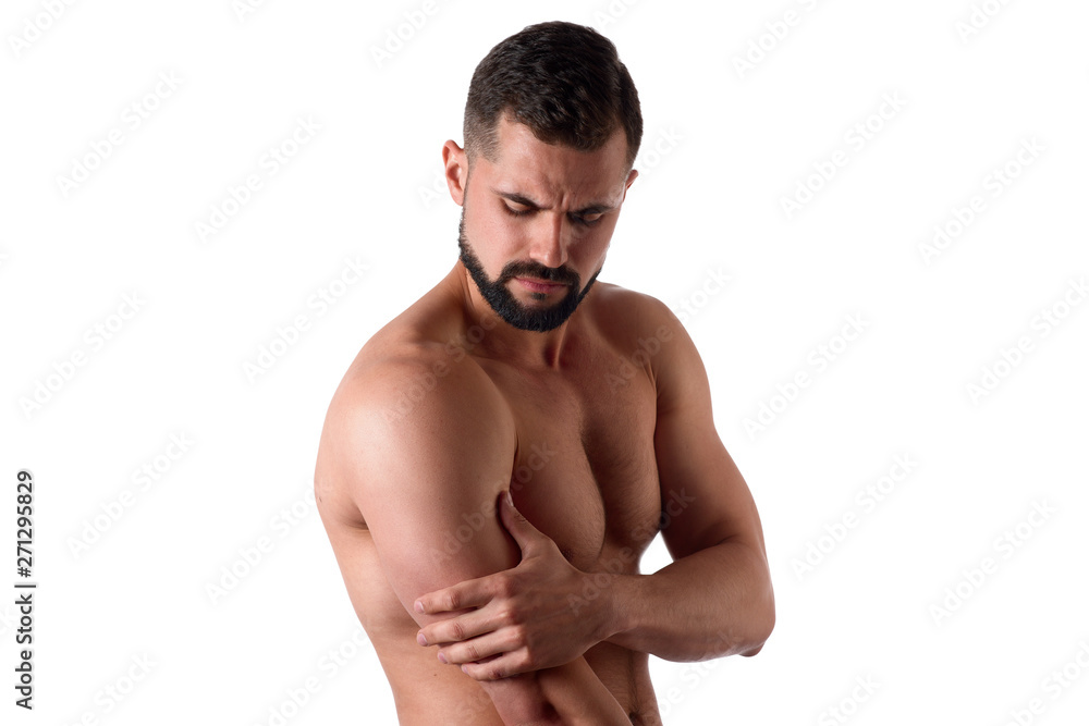 Muscular strong man with shoulder pain, isolated on white background. Sportsman holds his sore shoulder Muscular strong man with shoulder pain, isolated on white background. Sportsman holds his sore shoulder