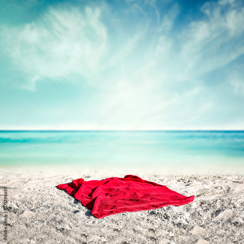Summer towel on beach and ocean landscape. Free space for your decoration and sun light Summer towel on beach and ocean landscape. Free space for your decoration and sun light