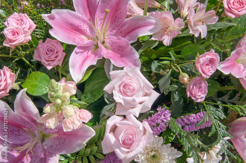 Bouquet of flowers of Lily Anastasia  roses and chrysanthemums