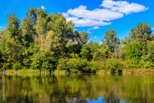 Summer landscape with beautiful river  green trees and blue sky