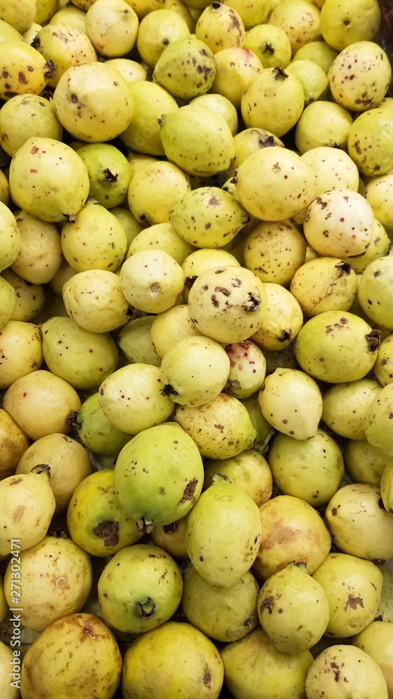 Bulk of guavas on the shelf of a supermarket. Typical tropical fruit in Latin America, rich in vitamins. Bulk of guavas on the shelf of a supermarket. Typical tropical fruit in Latin America, rich in vitamins.