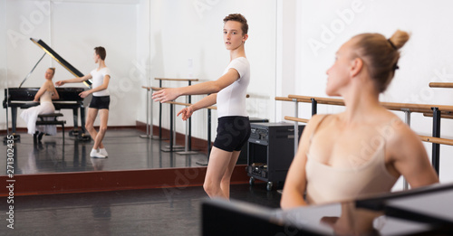 Ballet lesson in the studio. Choreographer plays the piano