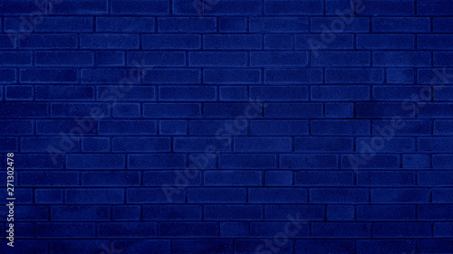 Grunge brick wall blue texture navy blue background.