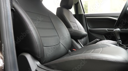 beautiful leather car interior design. faux leather front seats in car. luxury leather seats in the car. Black leather seat covers in the car.
