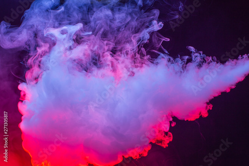 Colourful cloud of vapor. dark black background