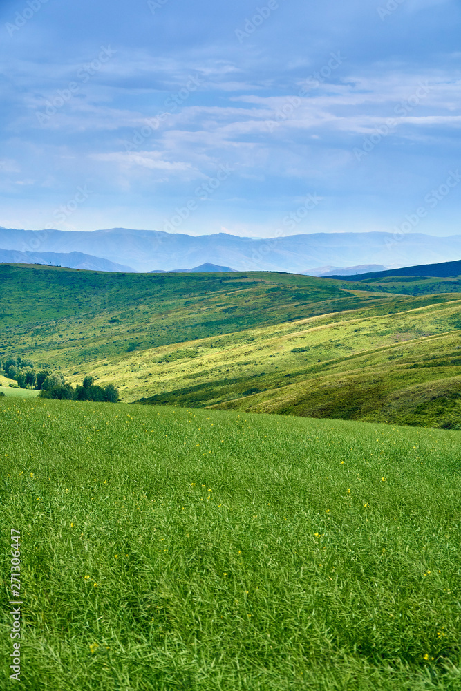 Beautiful panoramic aerial summer view at sunset to the Bukhtarma mountains in the valley of the river Irtysh, eastern Kazakhstan Beautiful panoramic aerial summer view at sunset to the Bukhtarma mountains in the valley of the river Irtysh, eastern Kazakhstan