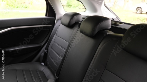 artificial leather rear seats in car. beautiful leather car interior design. luxury leather seats in the car. Black leather seat covers in the car. © zoteva87