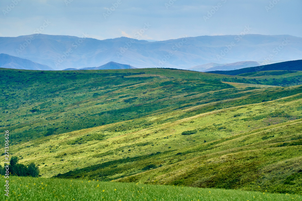 Beautiful panoramic aerial summer view at sunset to the Bukhtarma mountains in the valley of the river Irtysh, eastern Kazakhstan Beautiful panoramic aerial summer view at sunset to the Bukhtarma mountains in the valley of the river Irtysh, eastern Kazakhstan