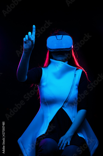 Woman is using virtual reality headset.