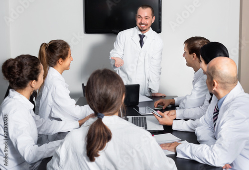 Scientist presenting report during working meeting