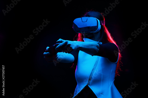 Woman with virtual reality headset is playing game. © nuclear_lily