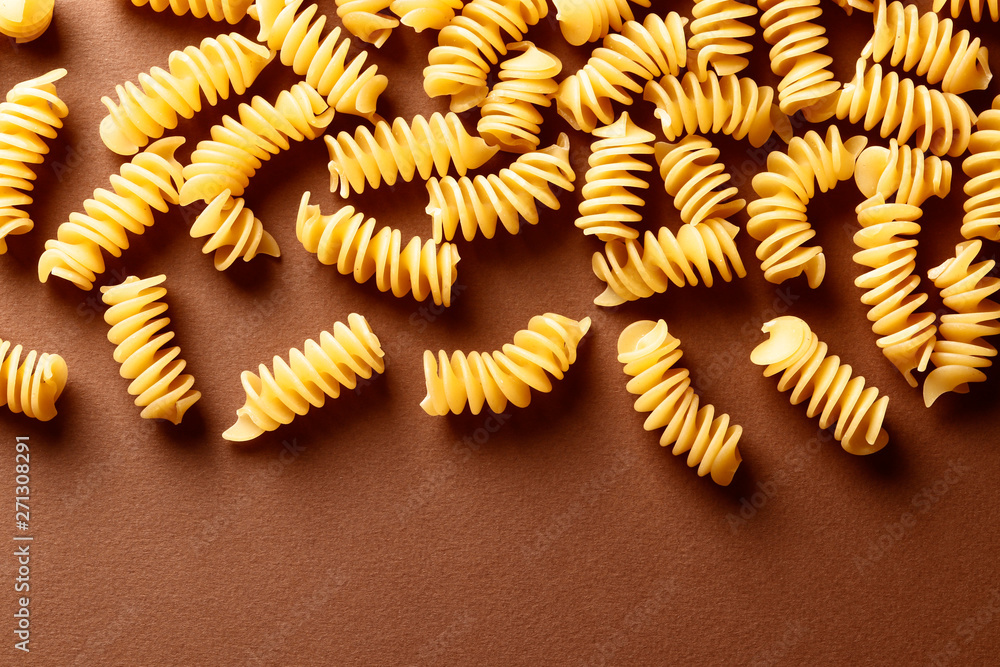 Flat lay composition with raw pasta on color background Flat lay composition with raw pasta on color background