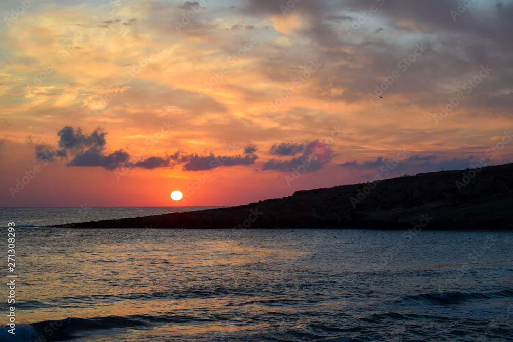 Romantic sunset sky and beautiful sea in Greece