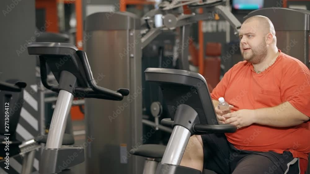 Young man making interval cycling for weightloss Young man making interval cycling for weightloss