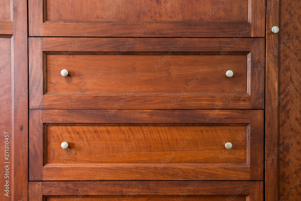 Close up of a closed wooden door brown design background texture vintage interior Close up of a closed wooden door brown design background texture vintage interior