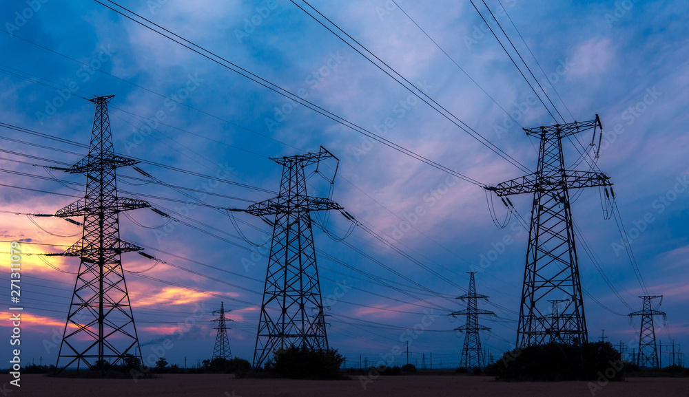 electricity pylons at sunset