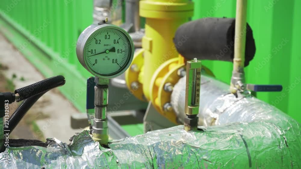 Pressure Measurement Device With Arrows Movements Near Pipe Close Up 4K. Circular Industrial