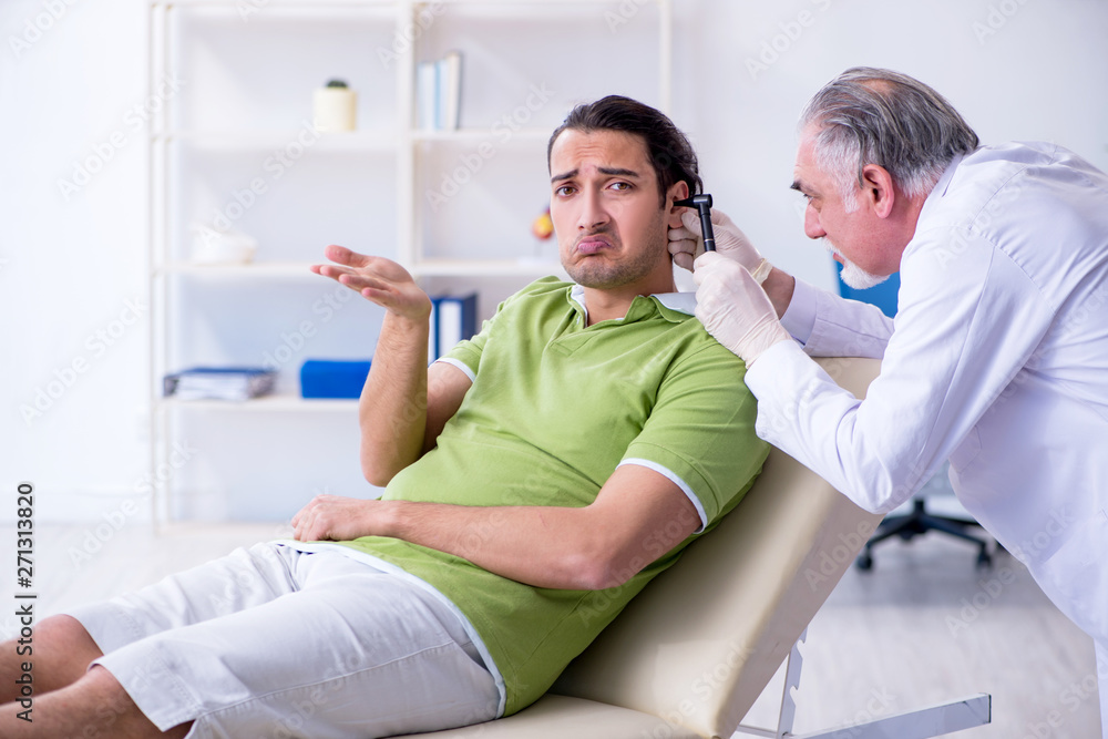Fototapeta premium Male patient visiting doctor otolaryngologist