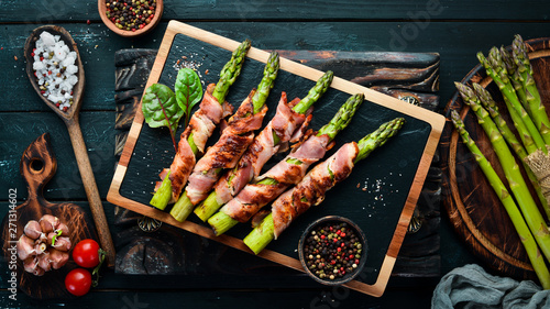 Asparagus baked with bacon and spices. Healthy food. Top view. Free space for your text.