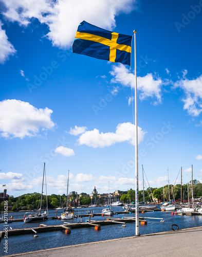Canvas Print Swedish Flag on blue sky white clouds