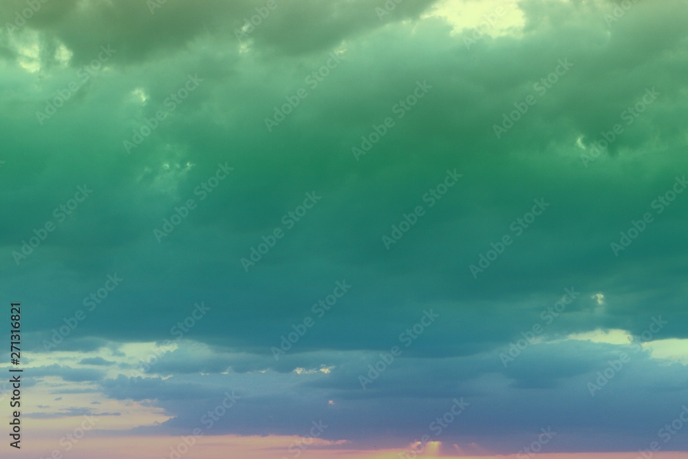 pretty toned sunset or sunrise clouds on the sky for using in design as background.