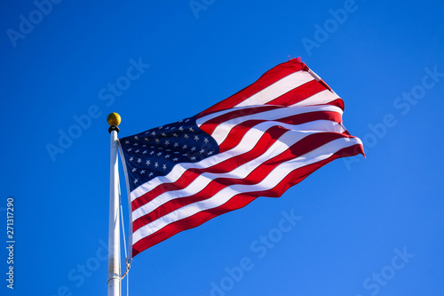 Close-up USA Flag Waving on a High Quality Clear Blue Sky