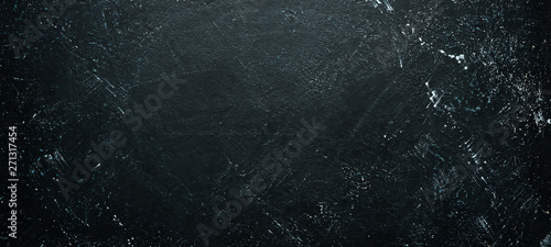 Black stone background. Top view. Free space for your text.