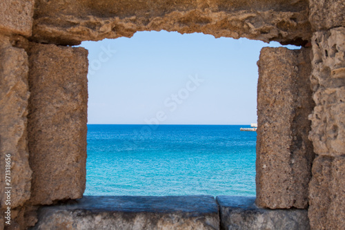 view of the sea through the walls of the castle