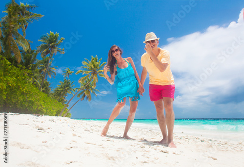 happy young couple having fun by the beach © el.rudakova