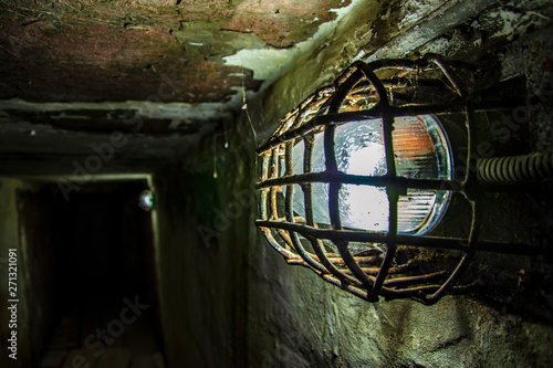 Shabby walls and a lantern in a prison corridor in the most terrible prison in Russia photo