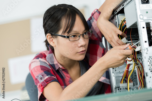 portrait of female and pc repairman fixing computer
