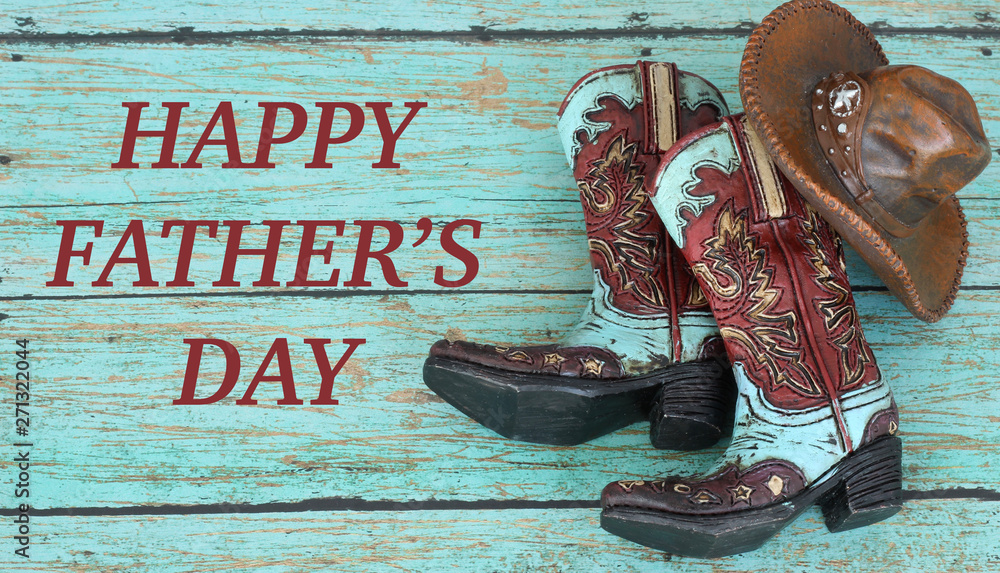 cowboy boots and hat laying on a teal wood background with happy fathers day  in brown text Stock Photo | Adobe Stock