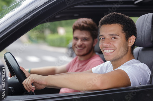 happy young man driving a car © auremar