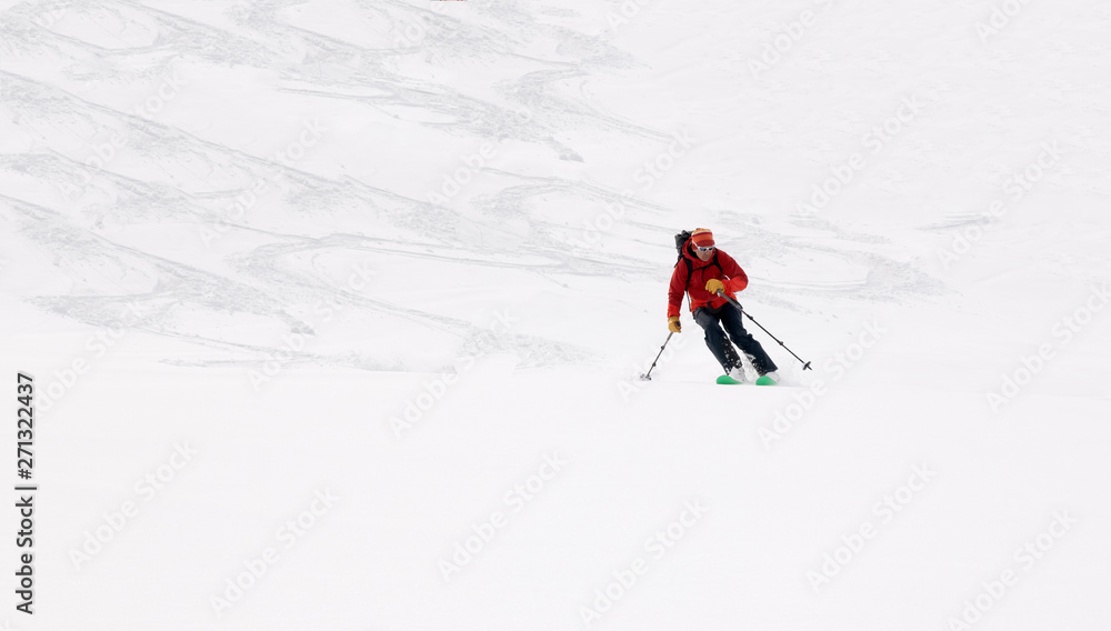 Georgia, Caucasus, Gudauri, man on a ski tour riding downhill Georgia, Caucasus, Gudauri, man on a ski tour riding downhill