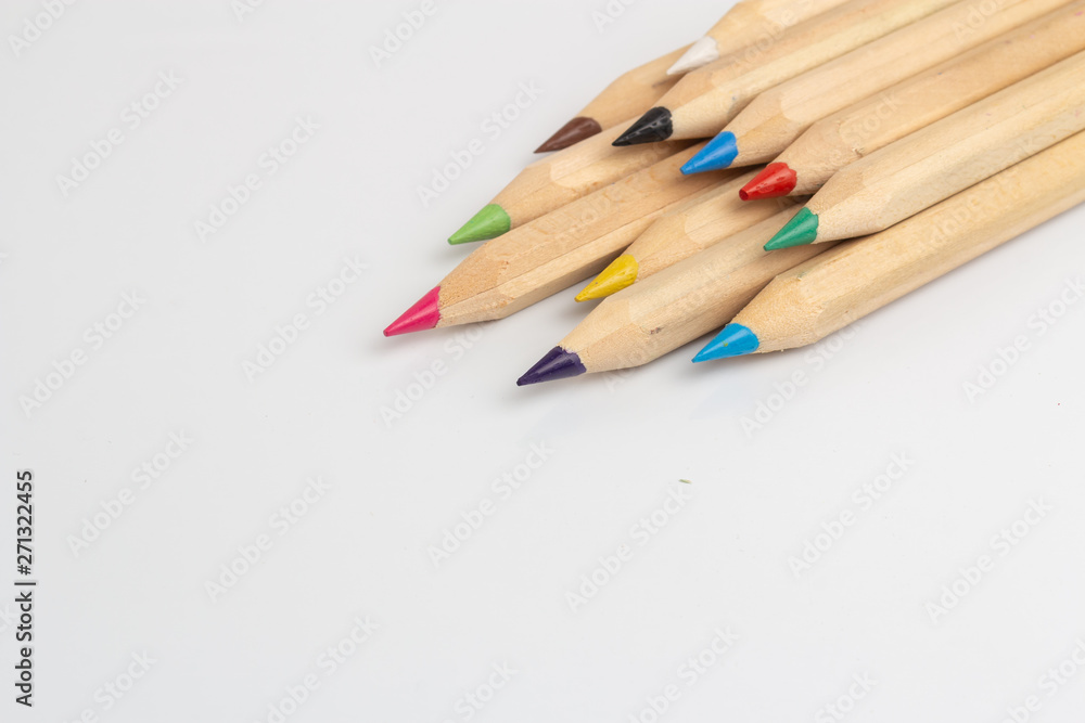 Color pencils are on the white table. Color pencils are on the white table.