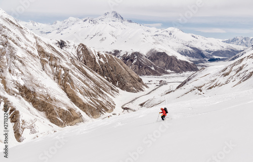 Georgia, Caucasus, Gudauri, man on a ski tour riding downhill