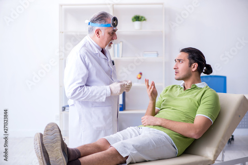 Male patient visiting doctor otolaryngologist