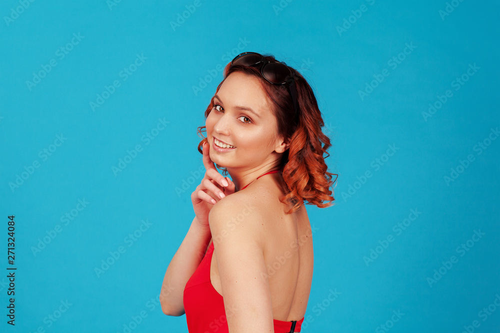 young girl on blue background smiling young girl on blue background smiling