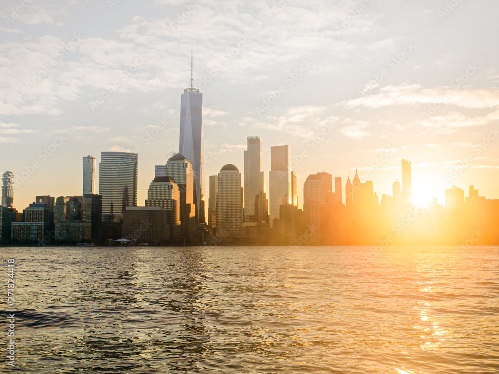 Lower Manhattan at sunrise with lens flare