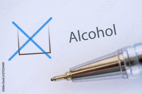 checkmark in the questionnaire and the inscription on the form - Alcohol