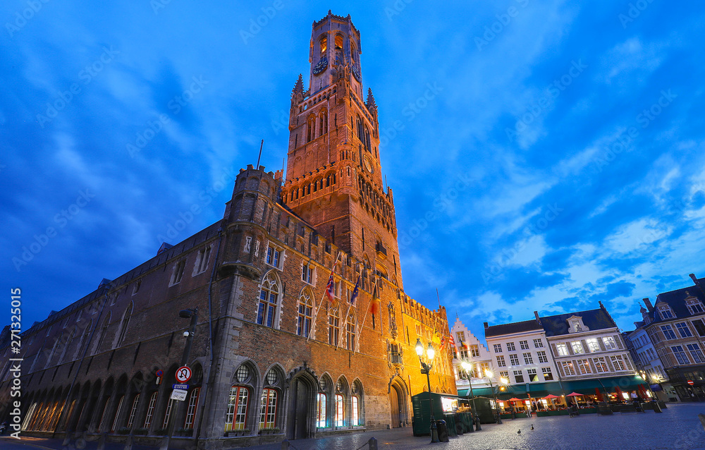Belfry Tower in historical center of Bruges at night, Belgium.