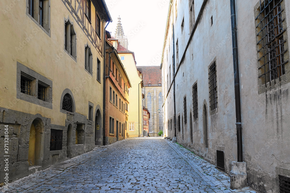 Deserted narrow cobblestone street in medieval village in Germany