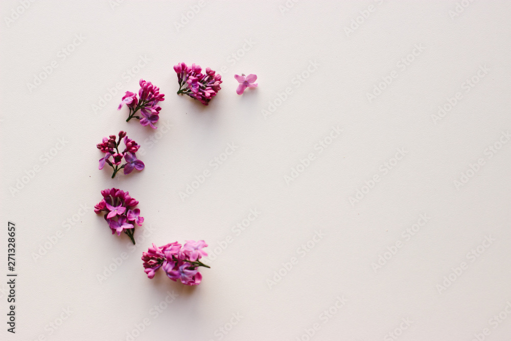 Beautiful flower frame on white background. Lilac flowers. Flat lay. 