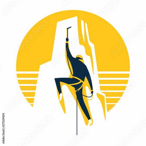 Rock climber.Athletic man climbing up the cliff