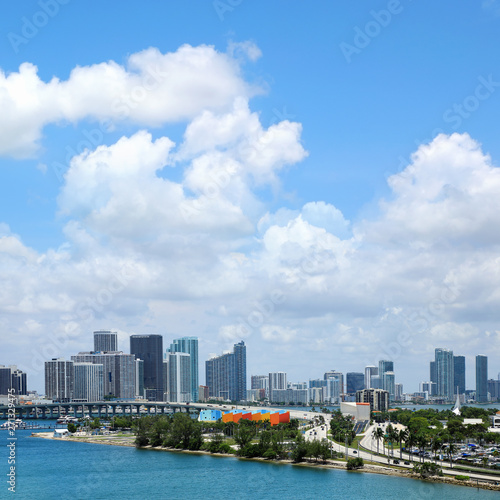 Cityscape of Miami downtown skyline over cloudy blue sky in Miami, Florida, USA